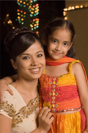 Woman with her daughter smiling Stock Photo - Premium Royalty-Free, Code: 630-03480211