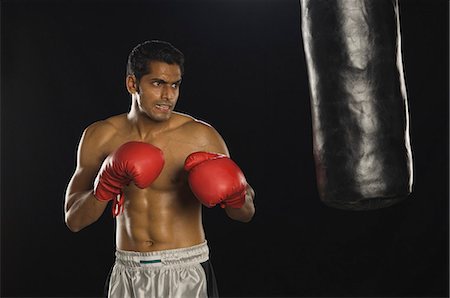 simsearch:400-03984387,k - Boxer practicing boxing Stock Photo - Premium Royalty-Free, Code: 630-03480358