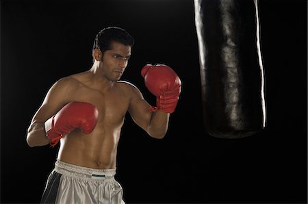 simsearch:400-03984387,k - Boxer practicing boxing Stock Photo - Premium Royalty-Free, Code: 630-03480360