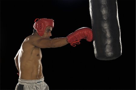 simsearch:400-03984387,k - Boxer practicing boxing Stock Photo - Premium Royalty-Free, Code: 630-03480361