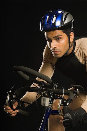Cyclist riding a racing bicycle Stock Photo - Premium Royalty-Free, Code: 630-03480377