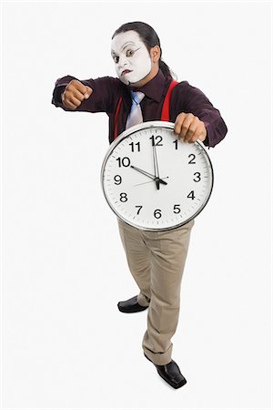 simsearch:6107-06117573,k - Mime showing a clock Stock Photo - Premium Royalty-Free, Code: 630-03480645