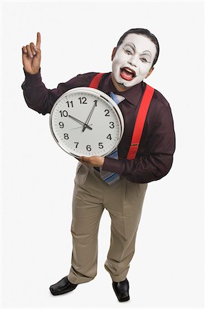 simsearch:6107-06117573,k - Mime showing a clock Stock Photo - Premium Royalty-Free, Code: 630-03480649