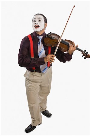 funny pictures indians people - Mime playing a violin Stock Photo - Premium Royalty-Free, Code: 630-03480652