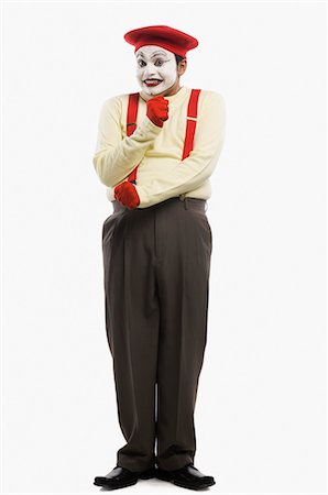 Portrait of a mime showing fist Stock Photo - Premium Royalty-Free, Code: 630-03480661