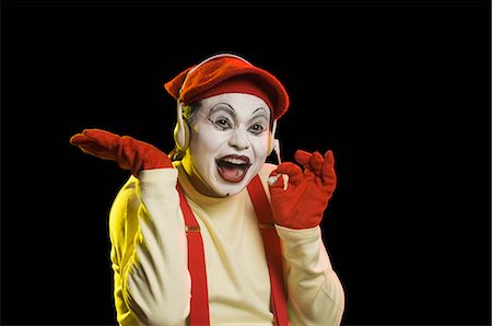 standing concept individuality concept - Close-up of a mime wearing a headset Foto de stock - Sin royalties Premium, Código: 630-03480704