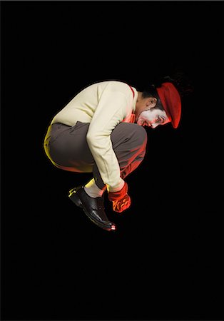 Mime jumping in mid-air Stock Photo - Premium Royalty-Free, Code: 630-03480709
