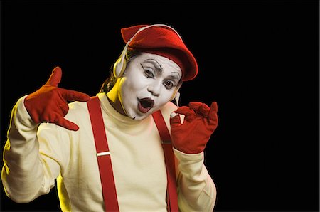 standing concept individuality concept - Close-up of a mime wearing a headset Foto de stock - Sin royalties Premium, Código: 630-03480700