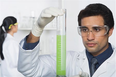simsearch:625-02929180,k - Scientist holding a burette Stock Photo - Premium Royalty-Free, Code: 630-03480791