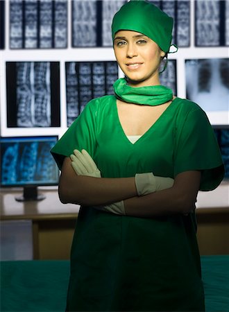 simsearch:625-02929180,k - Portrait of a female surgeon smiling Stock Photo - Premium Royalty-Free, Code: 630-03480827