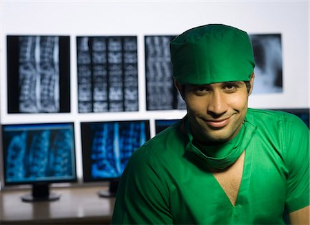 simsearch:625-02929180,k - Portrait of a male surgeon smiling Stock Photo - Premium Royalty-Free, Code: 630-03480823