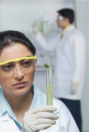 Scientist holding plants in test tube Stock Photo - Premium Royalty-Free, Code: 630-03480955