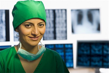 simsearch:625-02929180,k - Portrait of a female doctor smiling Stock Photo - Premium Royalty-Free, Code: 630-03480997