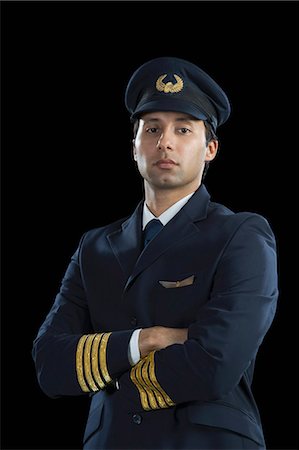 Portrait of a pilot with his arms crossed Stock Photo - Premium Royalty-Free, Code: 630-03481117