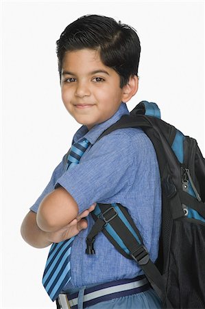 schoolbag - Portrait of a schoolboy smiling Stock Photo - Premium Royalty-Free, Code: 630-03481286