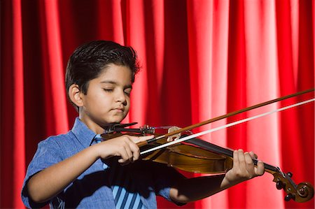 stage play curtain - Schoolboy playing a violin on a stage Stock Photo - Premium Royalty-Free, Code: 630-03481295