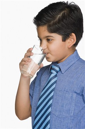 simsearch:630-07071771,k - Schoolboy drinking a glass of water Stock Photo - Premium Royalty-Free, Code: 630-03481293