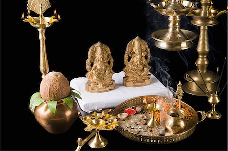 smoking pot - Diwali thali in front of idols of Lord Ganesha and Goddess Lakshmi Stock Photo - Premium Royalty-Free, Code: 630-03482077