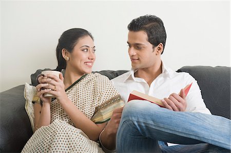 saree couples - Couple sitting on a couch Stock Photo - Premium Royalty-Free, Code: 630-03482659