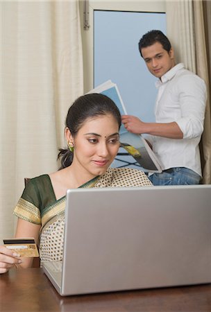 simsearch:625-00801205,k - Woman doing home shopping on a laptop Stock Photo - Premium Royalty-Free, Code: 630-03482653