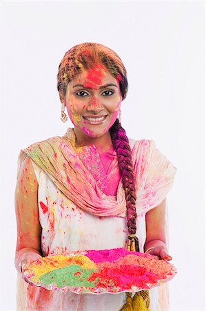 Woman holding a plate of powder paint on Holi Stock Photo - Premium Royalty-Free, Code: 630-03482905