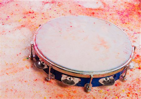 red music - Close-up of a tambourine with Holi colors Stock Photo - Premium Royalty-Free, Code: 630-03482919