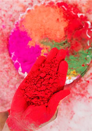 fingers holding - Close-up of a person's hand holding Holi colors Stock Photo - Premium Royalty-Free, Code: 630-03482921