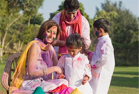 Family celebrating Holi with colors Stock Photo - Premium Royalty-Free, Code: 630-03483013