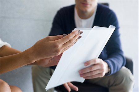 Woman's hand holding document Stock Photo - Premium Royalty-Free, Code: 632-05400884