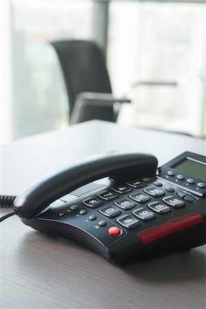 Landline phone on desk Stock Photo - Premium Royalty-Free, Code: 632-05400948