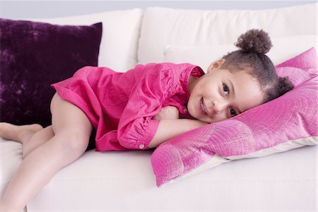 Little girl lying on couch Stock Photo - Premium Royalty-Free, Code: 632-05401170