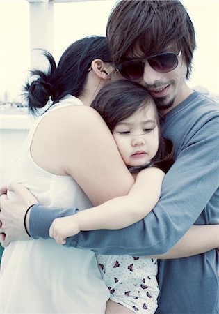 simsearch:632-03848361,k - Parents and young daughter embracing Stock Photo - Premium Royalty-Free, Code: 632-05554006