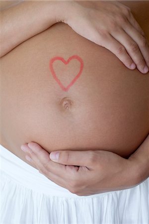 Coeur dessiné sur le ventre de femme enceinte femme Photographie de stock - Premium Libres de Droits, Code: 632-05554019