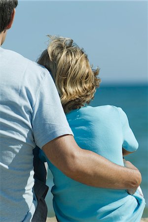 people sitting back - Father and son sitting together at the beach, rear view Stock Photo - Premium Royalty-Free, Code: 632-05554080