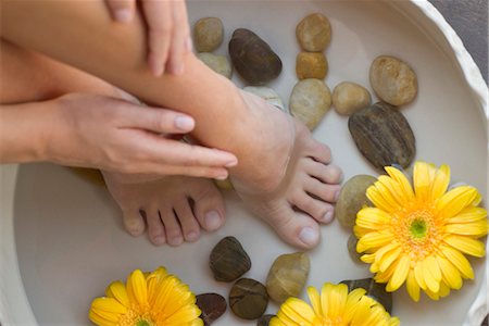 Woman enjoying relaxing foot bath Stock Photo - Premium Royalty-Free, Code: 632-05553558