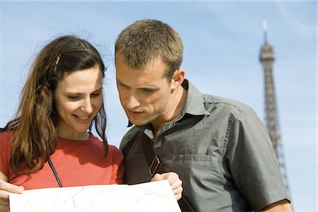 Tourists looking at map Stock Photo - Premium Royalty-Free, Code: 632-05553689
