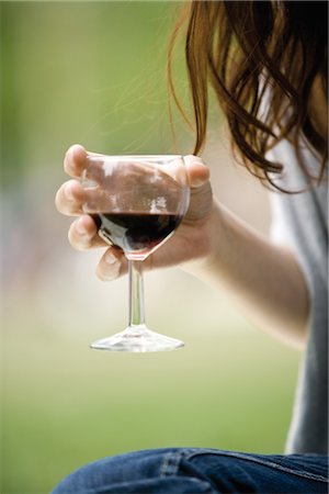 red wine people - Woman holding glass of red wine, cropped Stock Photo - Premium Royalty-Free, Code: 632-05553815