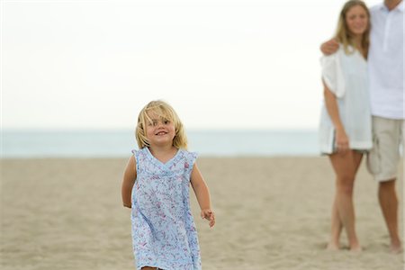 Little girl running at the beach Stock Photo - Premium Royalty-Free, Code: 632-05604025