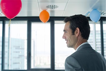 simsearch:632-05604036,k - Business executive in room with balloons Stock Photo - Premium Royalty-Free, Code: 632-05604036