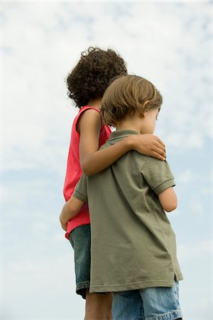 Young siblings standing together outdoors Stock Photo - Premium Royalty-Free, Code: 632-05604030