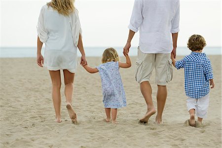 rear view little girl - Family walking hand in hand at the beach Stock Photo - Premium Royalty-Free, Code: 632-05604127