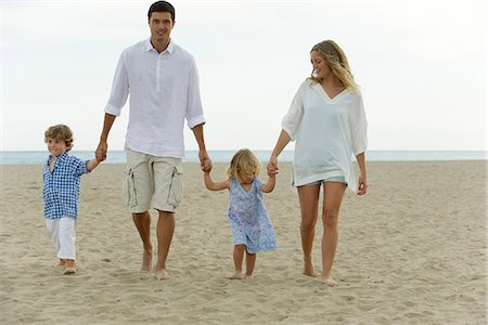 Family walking hand in hand at the beach Stock Photo - Premium Royalty-Free, Code: 632-05604215