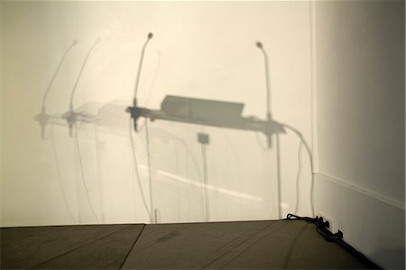 simsearch:632-05604064,k - Shadow of podium on conference room wall Stock Photo - Premium Royalty-Free, Code: 632-05604319