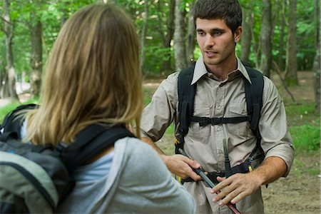 friends hiking in forest - Hikers chatting in woods Stock Photo - Premium Royalty-Free, Code: 632-05603882