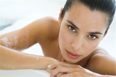 simsearch:632-05760692,k - Woman soaking in bath, leaning against edge of bathtub Stock Photo - Premium Royalty-Free, Code: 632-05759572