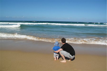 father son shore - Father and baby at the beach, looking at sea Stock Photo - Premium Royalty-Free, Code: 632-05759787