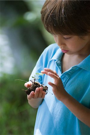 earth day - Boy holding plant seedling Stock Photo - Premium Royalty-Free, Code: 632-05759855