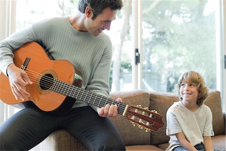 Father playing guitar for son Stock Photo - Premium Royalty-Free, Code: 632-05759852
