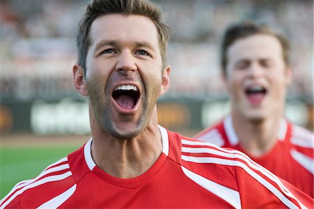 Soccer players shouting in victory Stock Photo - Premium Royalty-Free, Code: 632-05760181