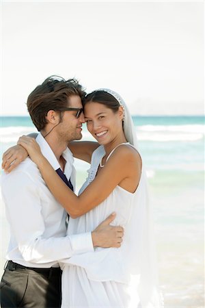 Bride and groom embracing a the beach Stock Photo - Premium Royalty-Free, Code: 632-05760387